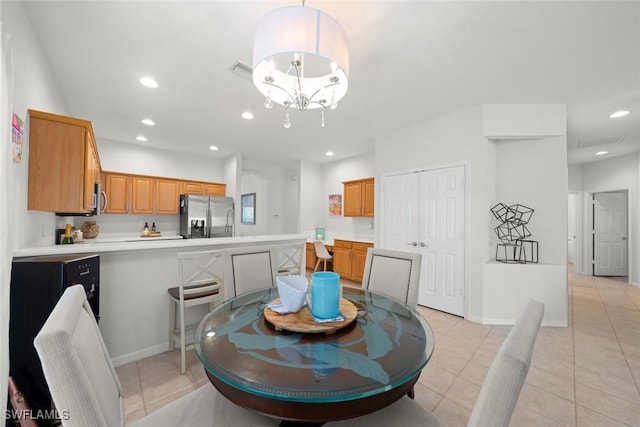 9795 Gladiolus Bulb Loop, Fort Myers, FL 33908 - dining area featuring light tile patterned floors, recessed lighting, and a chandelier