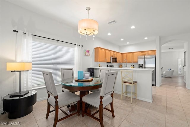 9795 Gladiolus Bulb Loop, Fort Myers, FL 33908 - dining room featuring light tile patterned floors, plenty of natural light, arched walkways, and recessed lighting