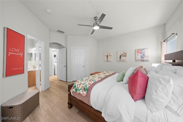 9795 Gladiolus Bulb Loop, Fort Myers, FL 33908 - bedroom featuring wood finished floors, arched walkways, connected bathroom, and a ceiling fan