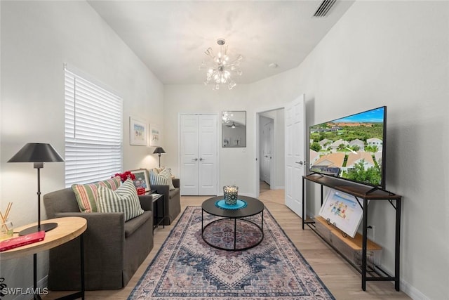 9795 Gladiolus Bulb Loop, Fort Myers, FL 33908 - living area with a chandelier and light wood-type flooring