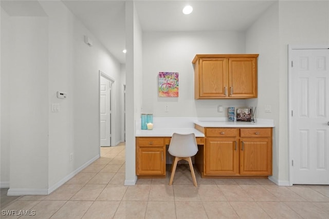 9795 Gladiolus Bulb Loop, Fort Myers, FL 33908 - home office with built in desk, recessed lighting, and light tile patterned floors