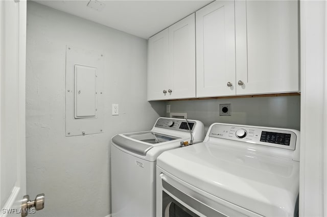 7148 Estero Blvd Unit 922, Fort Myers Beach, FL 33931 - washroom featuring independent washer and dryer, cabinet space, and electric panel