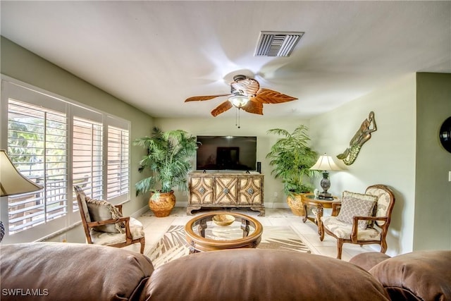 225 SW 43rd Ln, Cape Coral, FL 33914 - tiled living room featuring ceiling fan and baseboards