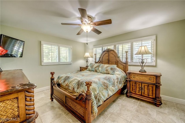 225 SW 43rd Ln, Cape Coral, FL 33914 - bedroom with baseboards and a ceiling fan