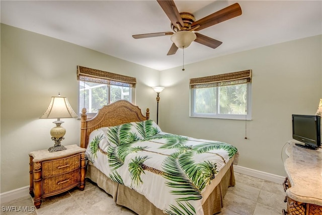 225 SW 43rd Ln, Cape Coral, FL 33914 - bedroom featuring baseboards and ceiling fan