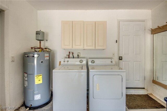 225 SW 43rd Ln, Cape Coral, FL 33914 - washroom with electric water heater, cabinet space, and independent washer and dryer