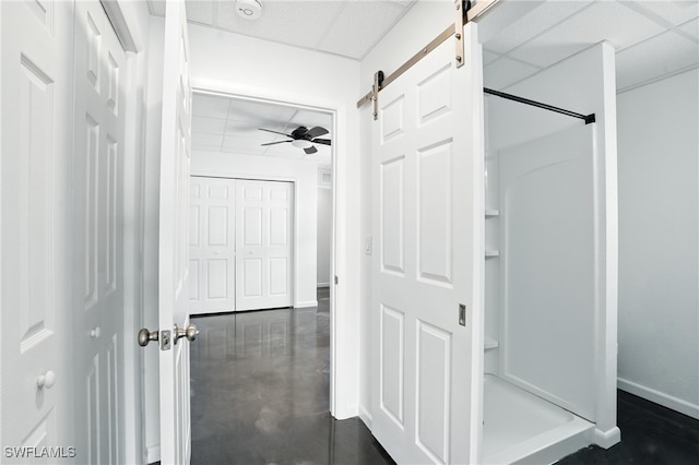 131 Bay Mar Dr, Fort Myers Beach, FL 33931 - bathroom with a shower stall, a paneled ceiling, finished concrete floors, and a ceiling fan