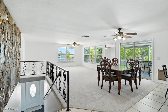 131 Bay Mar Dr, Fort Myers Beach, FL 33931 - carpeted dining space featuring a ceiling fan and tile patterned flooring