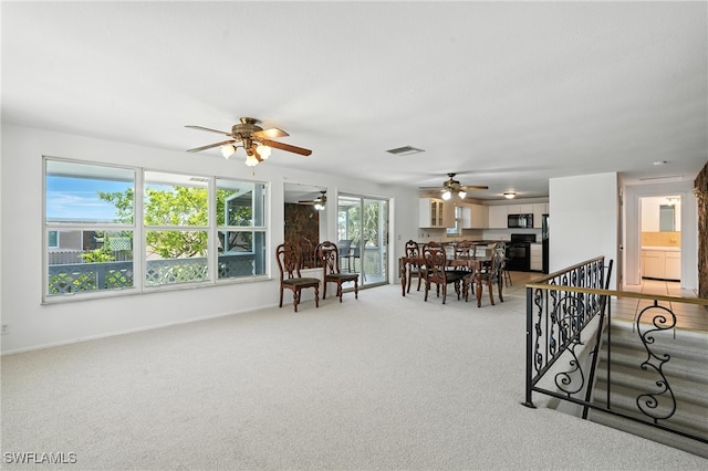 131 Bay Mar Dr, Fort Myers Beach, FL 33931 - living room featuring ceiling fan and light carpet
