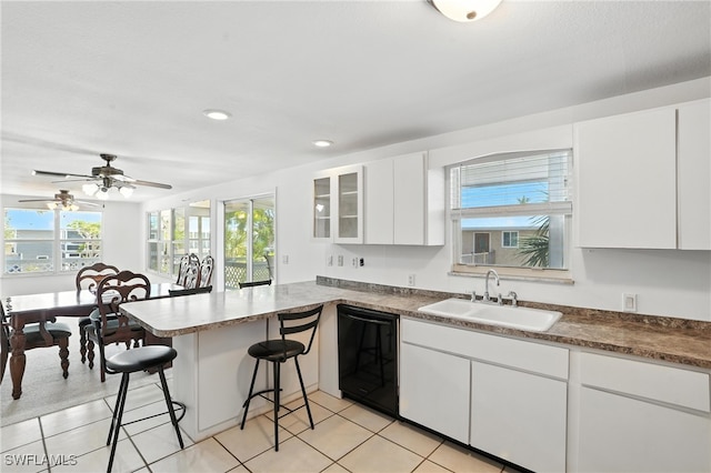 131 Bay Mar Dr, Fort Myers Beach, FL 33931 - kitchen featuring dishwasher, a peninsula, a kitchen breakfast bar, white cabinets, and recessed lighting