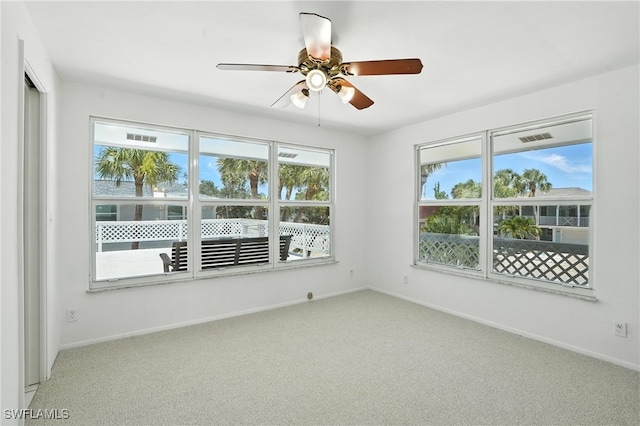 131 Bay Mar Dr, Fort Myers Beach, FL 33931 - carpeted empty room with ceiling fan and baseboards