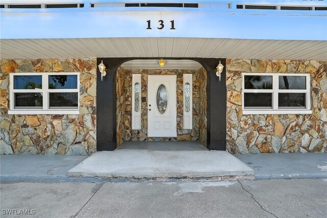 131 Bay Mar Dr, Fort Myers Beach, FL 33931 - entrance to property featuring stone siding