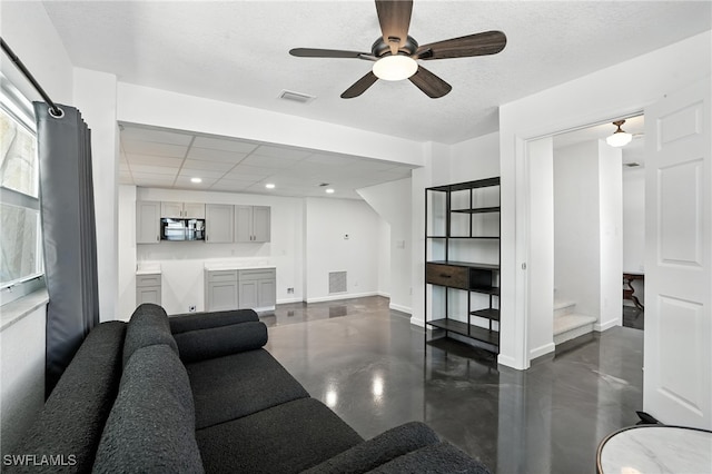 131 Bay Mar Dr, Fort Myers Beach, FL 33931 - living area with concrete flooring, a ceiling fan, recessed lighting, and stairs