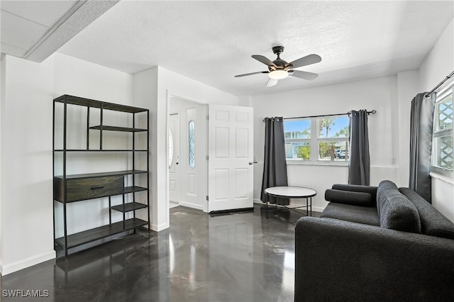 131 Bay Mar Dr, Fort Myers Beach, FL 33931 - living room with ceiling fan and a textured ceiling