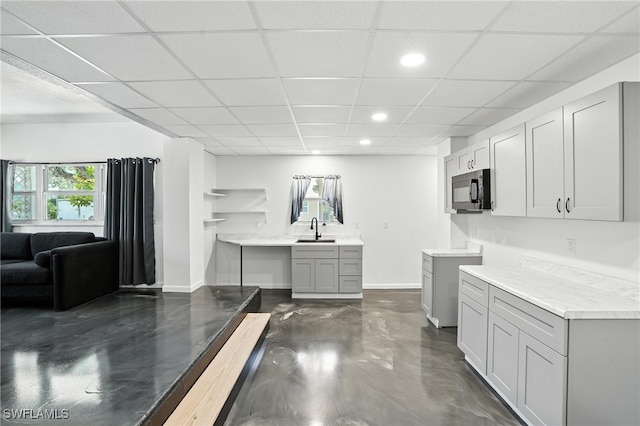 131 Bay Mar Dr, Fort Myers Beach, FL 33931 - kitchen featuring black microwave, a paneled ceiling, recessed lighting, concrete floors, and light countertops