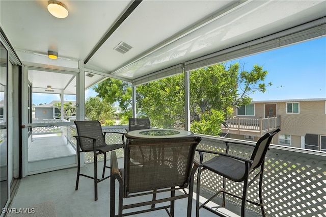 131 Bay Mar Dr, Fort Myers Beach, FL 33931 - sunroom featuring outdoor dining area