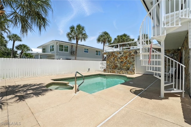 131 Bay Mar Dr, Fort Myers Beach, FL 33931 - view of swimming pool with a fenced backyard, a patio area, and a pool with connected hot tub
