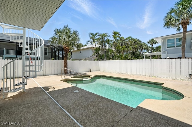 131 Bay Mar Dr, Fort Myers Beach, FL 33931 - view of pool featuring a patio area, a fenced backyard, and a pool with connected hot tub