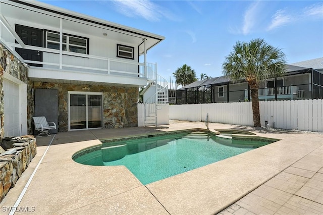 131 Bay Mar Dr, Fort Myers Beach, FL 33931 - view of swimming pool featuring stairway, a patio, and a pool with connected hot tub
