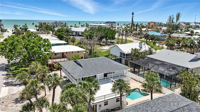 131 Bay Mar Dr, Fort Myers Beach, FL 33931 - drone / aerial view of a pool area and a nearby body of water