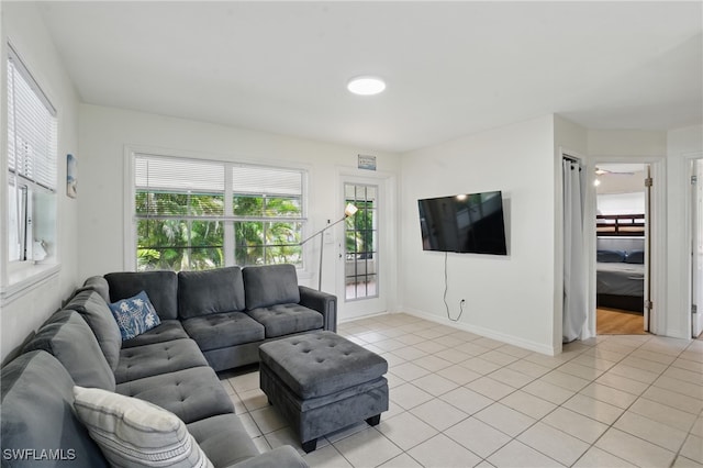 7434 Cares Away Park Cir, Bokeelia, FL 33922 - living area featuring light tile patterned flooring and baseboards