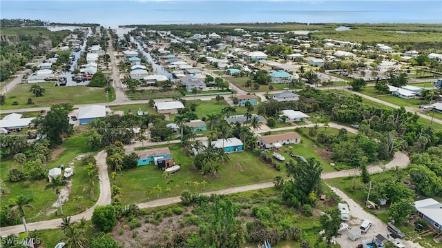 7434 Cares Away Park Cir, Bokeelia, FL 33922 - aerial overview of property's location featuring nearby suburban area
