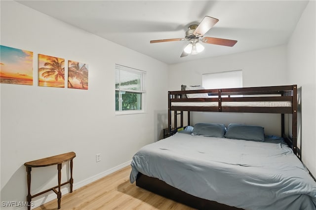 7434 Cares Away Park Cir, Bokeelia, FL 33922 - bedroom featuring wood finished floors and a ceiling fan