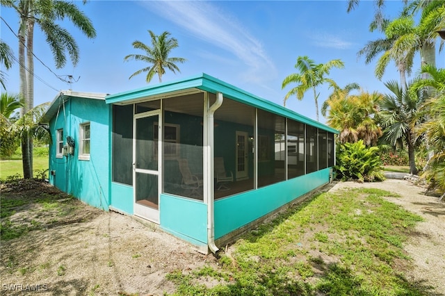 7434 Cares Away Park Cir, Bokeelia, FL 33922 - view of home's exterior featuring a sunroom