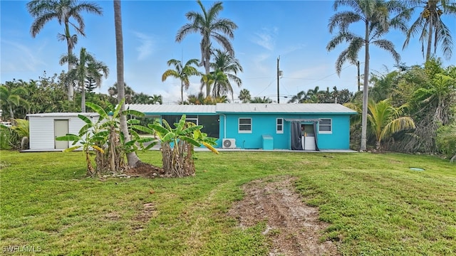 7434 Cares Away Park Cir, Bokeelia, FL 33922 - view of front of property featuring a front yard and stucco siding