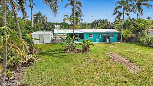 7434 Cares Away Park Cir, Bokeelia, FL 33922 - back of property with a lawn and a storage shed