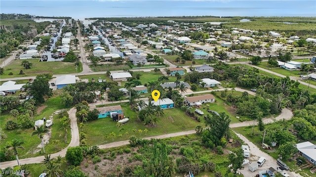 7434 Cares Away Park Cir, Bokeelia, FL 33922 - aerial view of property and surrounding area with nearby suburban area