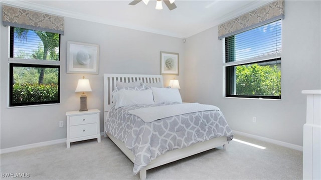 3668 Treasure Cove Ct, Naples, FL 34114 - bedroom with ornamental molding, carpet, and a ceiling fan