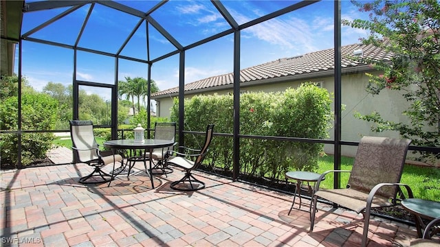 3668 Treasure Cove Ct, Naples, FL 34114 - sunroom / solarium featuring outdoor dining area