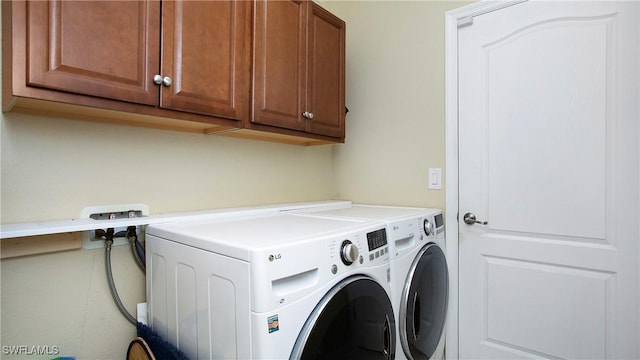 3668 Treasure Cove Ct, Naples, FL 34114 - laundry room featuring cabinet space and washing machine and dryer