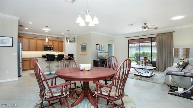 3668 Treasure Cove Ct, Naples, FL 34114 - dining space featuring light tile patterned flooring, crown molding, recessed lighting, a ceiling fan, and a chandelier