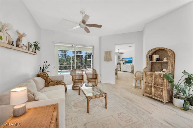 2391 35th Ave NE, Naples, FL 34120 - living room with a ceiling fan, wood finished floors, and a sunroom