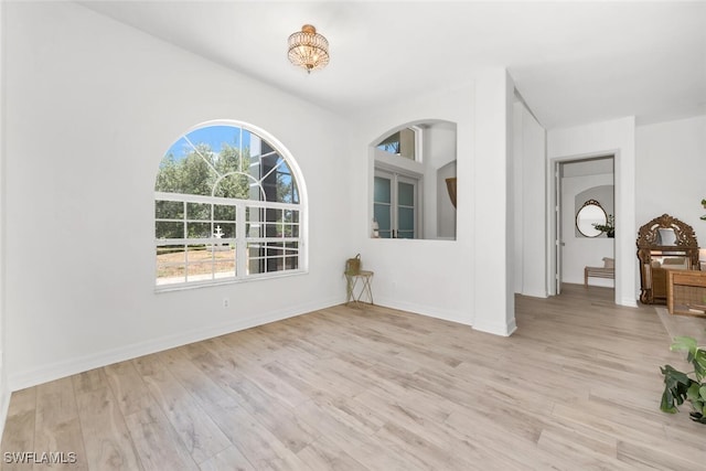 2391 35th Ave NE, Naples, FL 34120 - empty room with wood finished floors and baseboards