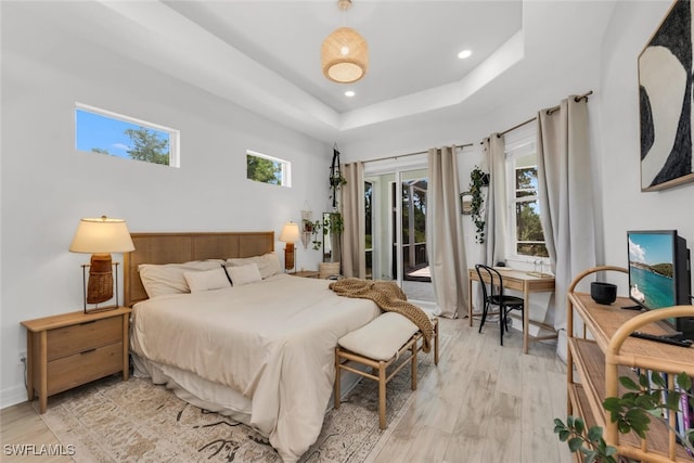 2391 35th Ave NE, Naples, FL 34120 - bedroom featuring access to exterior, light wood finished floors, a raised ceiling, and recessed lighting