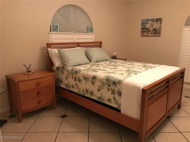 796 108th Ave N, Naples, FL 34108 - bedroom featuring light tile patterned floors