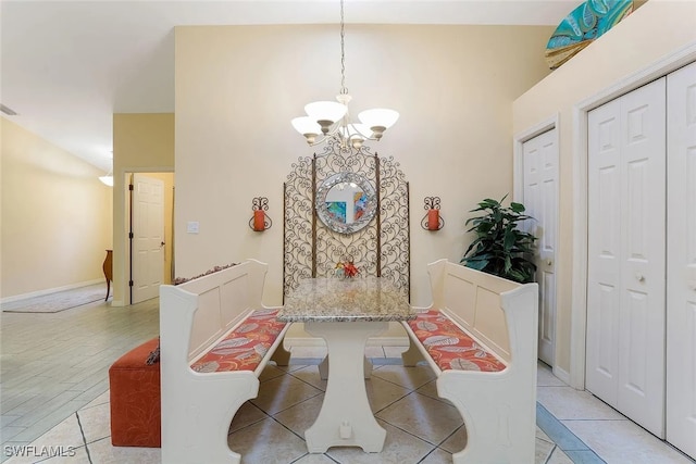 796 108th Ave N, Naples, FL 34108 - dining area featuring a chandelier and a towering ceiling