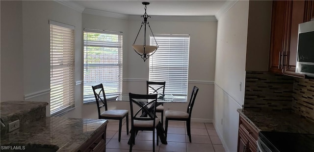 15539 Horseshoe Ln, Fort Myers, FL 33905 - dining area featuring crown molding and light tile patterned flooring