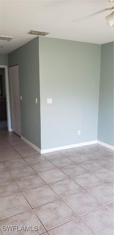 15539 Horseshoe Ln, Fort Myers, FL 33905 - unfurnished room with light tile patterned floors and baseboards