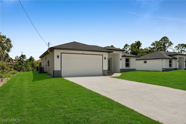 2704 22nd St W, Lehigh Acres, FL 33971 - prairie-style house featuring driveway, stucco siding, a garage, and a front yard
