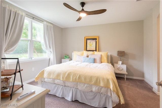 14727 Edgewater Cir, Naples, FL 34114 - carpeted bedroom with baseboards and a ceiling fan