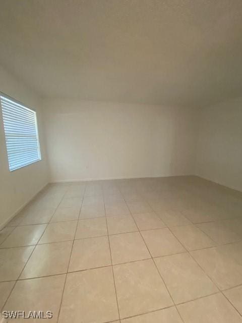 3325 Airport Pulling Rd N Unit F1, Naples, FL 34105 - spare room featuring light tile patterned floors