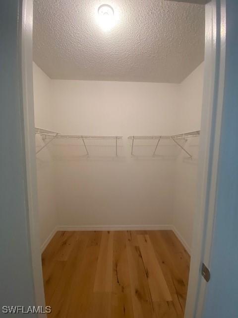 3325 Airport Pulling Rd N Unit F1, Naples, FL 34105 - spacious closet with light wood finished floors