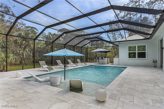 364 Logan Blvd S, Naples, FL 34119 - swimming pool featuring a patio and glass enclosure