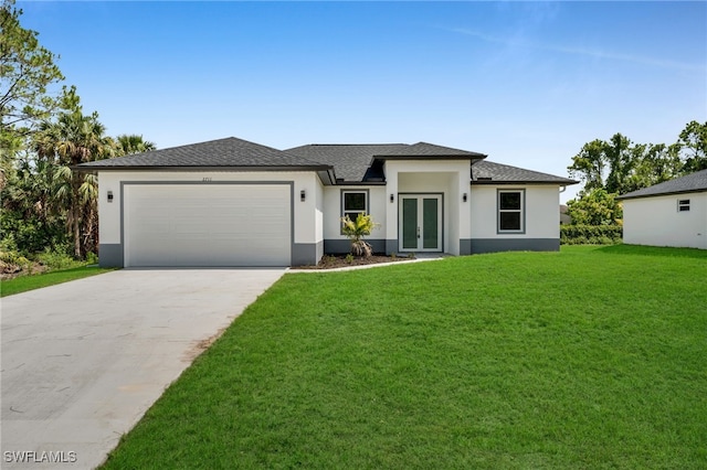2605 28th St W, Lehigh Acres, FL 33971 - prairie-style home featuring french doors, stucco siding, a garage, a front lawn, and concrete driveway