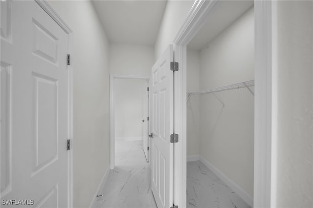 2605 28th St W, Lehigh Acres, FL 33971 - corridor featuring light marble finish floors and baseboards