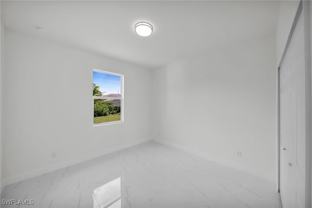 2605 28th St W, Lehigh Acres, FL 33971 - spare room featuring marble look tile flooring